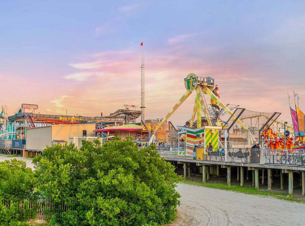 Wildwood boardwalk amusement rides at sunset